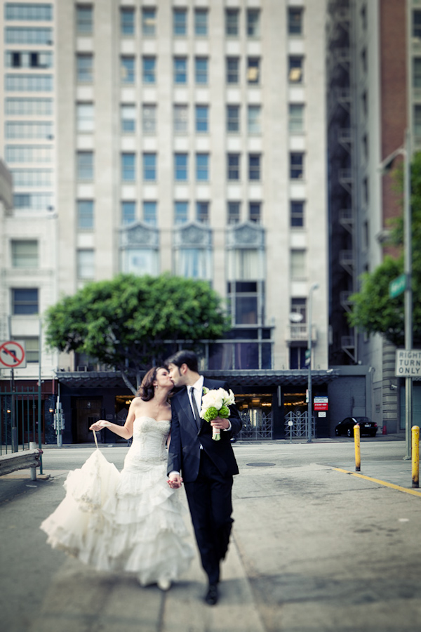happy couple kissing in street - photo by Southern California wedding photographers Callaway Gable